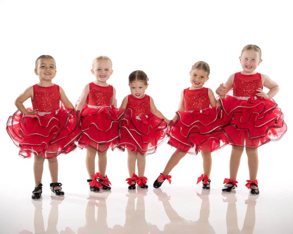 Toddler dancers in red costume and tap shoes